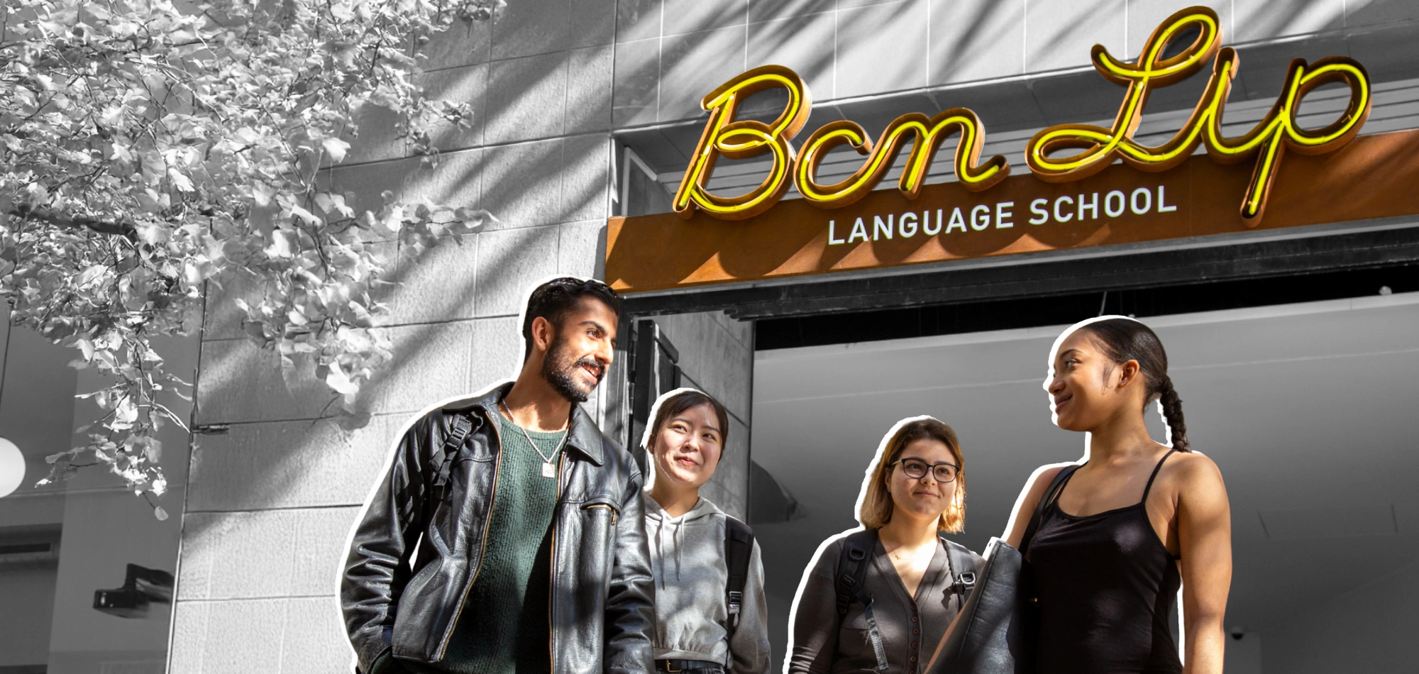Group of international students smiling and talking outside BCNLIP UP School in Barcelona.